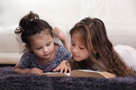 Young Siblings Learning the Word of God Togetherの写真素材