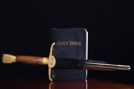 Old long sword beside the Holy Bibleの写真素材