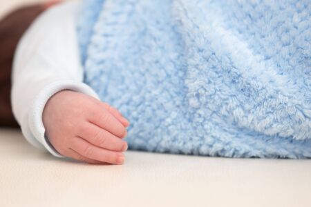 Bundled Sleeping Adorable Little Newborn Baby Closeupの写真素材