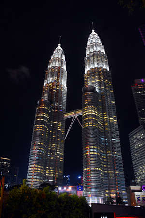 Kuala Lumpur, Malaysia, 08.14.2019: Beautiful Petronas Twin Towers illuminated with yellow, red,...