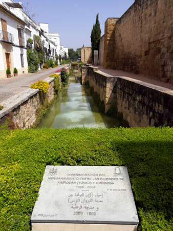 Cordoba, Spain 07.13.2017: Beautiful, stunning and amazingly colorful, well manicured garden with reflecting lakes and colorful flowers of Alcazar of the Christian Monarchsis which a medieval type of Moorish castle or palace located in the historic centerのeditorial素材