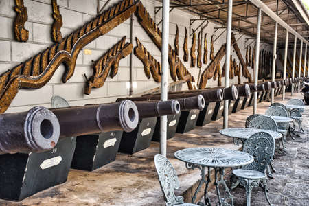 Characteristics of traditional Thai architecture created by artists who transform imagination to reality. Detailed, golden steeply-sloping tile roofs, up turned edges, open air spaces, lush gardensの写真素材