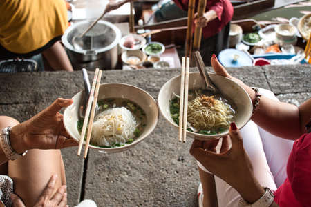 Damnoen Saduak, Thailand, 12.22.2019: The Famous Damnoen Saduak Floating Market with fruits, vegetables, foods and different items sold from small boats. Until recently, the main form of tradeのeditorial素材