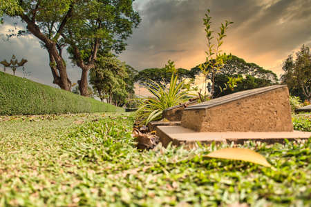 Kanchanaburi, Thailand 12.28.2019: Kanchanaburi War Cemetery or Don-Rak War Cemetery is the main prisoner of war (POW) cemetery for victims of Japanese imprisonment while building the Burma Railway.の写真素材
