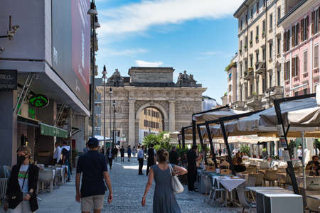 Milan, Italy 06.20.2020: People walking and having lunch on Corso Como complying with the social distancing requirementsのeditorial素材