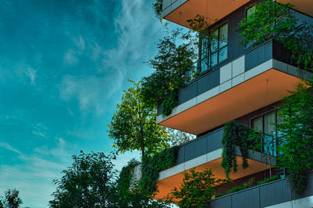 Milan, Italy, 06.29.2020: Balconies full with trees, plants on the Vertical Forest (Bosco Verticale) Innovative Green House Skyscraper representing commitment to sustainable economy designed by Boeriの写真素材