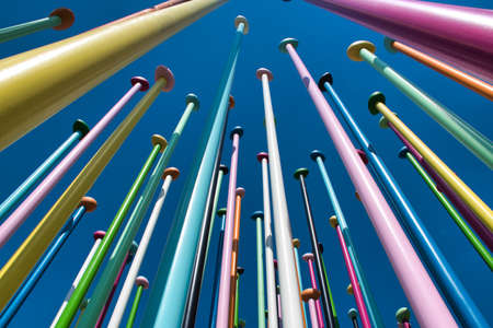 Milan, Italy 08.03.2020: Coloris installation by artist Pascale Marthine Tayou consists of a concrete surface with a representation of a world map onto which stand about 100 pastel-color metal polesのeditorial素材