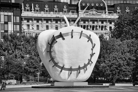 Milan, Italy 08.08.2020: La Mela Reintegrata, The Apple Made Whole Again sculpture in front of the Milano Centrale Railway Station. It is a symbolic work opening itself up to the world.のeditorial素材