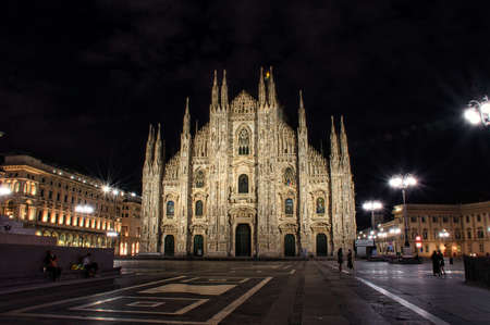 Milano, Italy, 12.08.2020: Colorful, stunning front of the magnificent Duomo di Milano or Milan Cathedral during the nightの写真素材