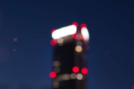 Abstract urban night light bokeh defocused background, city night in Milan