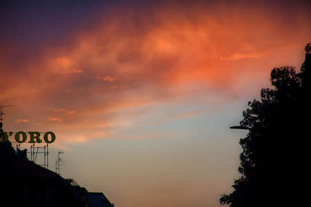 A purple golden night sky with clouds in Milan