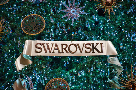 Milan, Italy 12.12.2020, Colorful, glowing, decorative Swarovski Christmas tree in Vittorio Emanuele II Galleryのeditorial素材