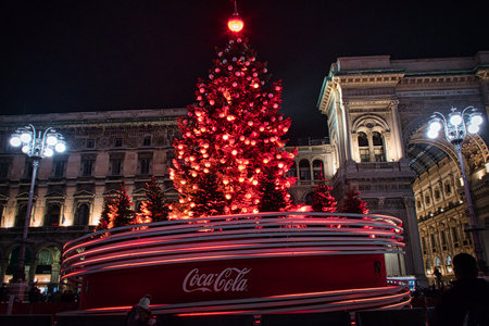 Milan, Italy 12.12.2020, Colorful, glowing, decorative Christmas tree in front of Duomo Cathedralのeditorial素材