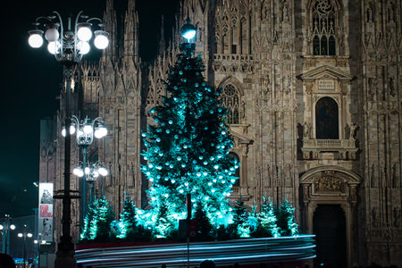 Milan, Italy 12.12.2020, Colorful, glowing, decorative Christmas tree in front of Duomo Cathedralのeditorial素材
