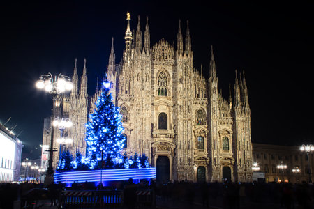 Milan, Italy 12.12.2020, Colorful, glowing, decorative Christmas tree in front of Duomo Cathedralのeditorial素材