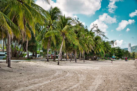 Phuket, Thailand April 19, 2021 Empty, calm sandy crescent Patong Beach with turquoise blue clear water and cirrus cloudy skyのeditorial素材
