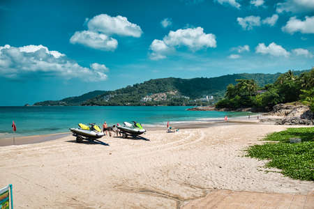Phuket, Thailand April 19, 2021 Empty, calm sandy crescent Patong Beach with turquoise blue clear water and cirrus cloudy skyのeditorial素材