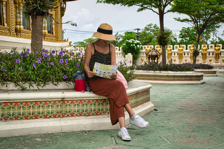 Bangkok, Thailand 04.07.2021 Young Thai girl is exploring the Ancient City park in Bangkokのeditorial素材