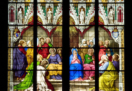 Stained glass church window depicting Pentecost in the Koln cathedral, Germany.のeditorial素材
