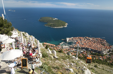 Cable car station, Dubrovnik, Croatia - 22/5/2015: Turists sitting at the restaurant enjoy the view of the city and the blue seaのeditorial素材