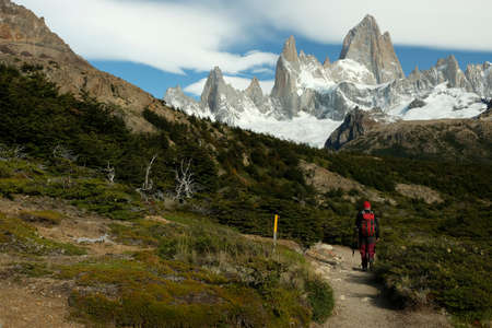 EL CHATEN, Argentina - March 8, 2020 - Walking toward Fitz Roy mountain in a partly cloudy sky, El Chaten, Argentinaのeditorial素材