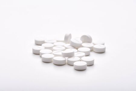 Still life with pile of round pills or tablets, antidepressants or painkillers with space for text....