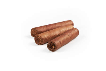 Three Cuban cigars isolated on a white background with shadowの写真素材