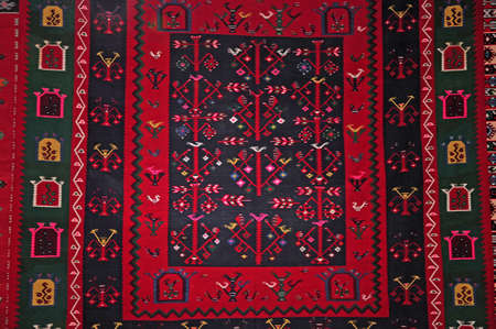 Segment of handmade carpets in bright colors