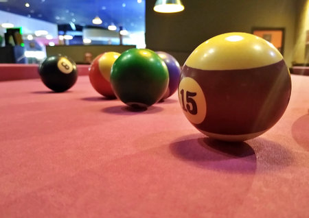 Close up of Pool balls on pink baize pool table