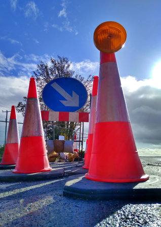 UK Traffic cones in the road with sun behindの写真素材