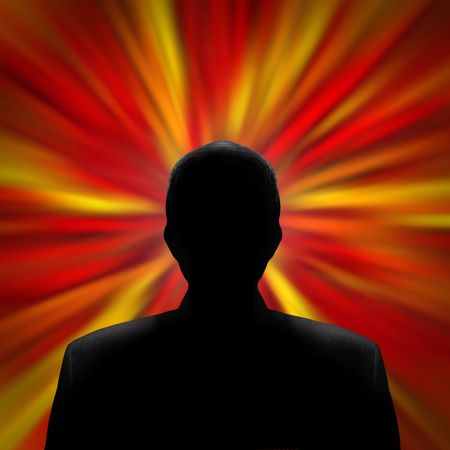 Black silhouette of a mysterious man in front of a red vortexの写真素材