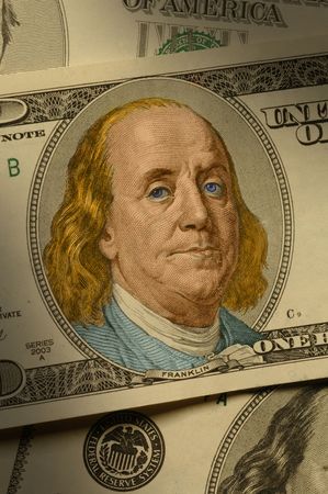 Close-up of Benjamin Franklin on the $100 bill, dramatically lit and hand-colored.の写真素材