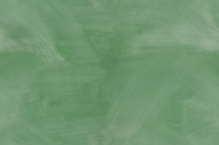 Green chalkboard with smeared chalk eraser marks seamlessly tileableの写真素材