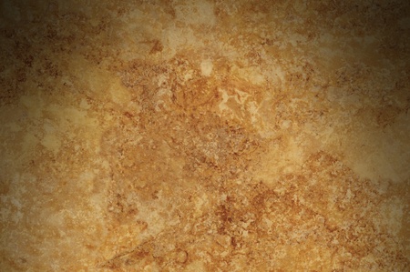 Brown mottled background surface texture lit from aboveの写真素材