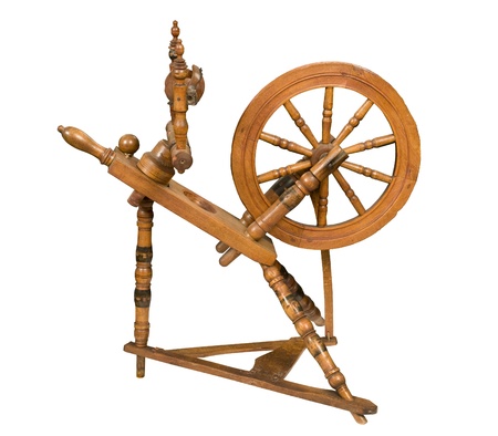 Antique spinning wheel against white backgroundの写真素材