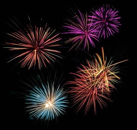 Multicolored fireworks display in a black night skyの写真素材