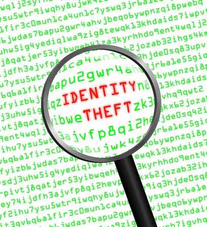 The words "Identity Theft" revealed in computer machine code through a magnifying glass in high-keyの写真素材