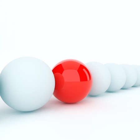 Unique red ball on a background white ballsの写真素材
