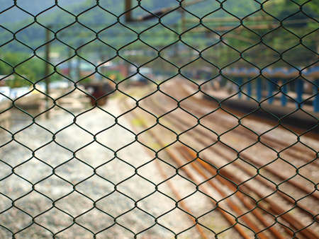 metal net and railway stationの写真素材