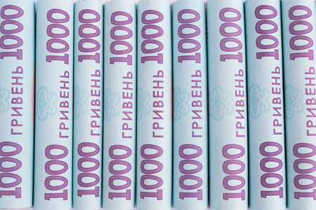 Ukrainian 1000 hryvnia. 1000 banknotes in rolls closeup. Money background.