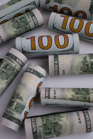 100 dollars rolled closeup. Money background. American money.の写真素材