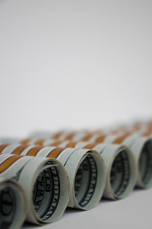 100 Dollars in rolls closeup. Money background. American money.の写真素材