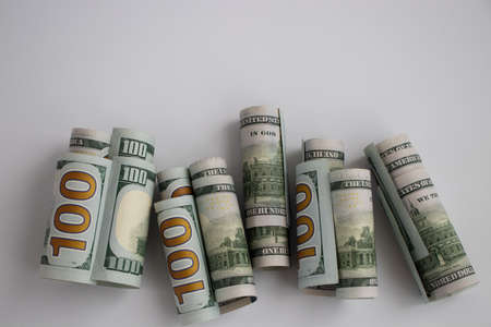 100 dollars. Money background from rolled American banknotes.