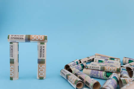 Construction from rolled Ukrainian 500 banknotes. Money constructor.の写真素材