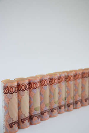 Russian money rolled on a white background.の写真素材