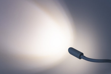 Light on the wall from lamp. Lamp is turned on. Place for text.の写真素材