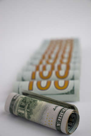 100 Dollars in rolls closeup. Money background. American money.