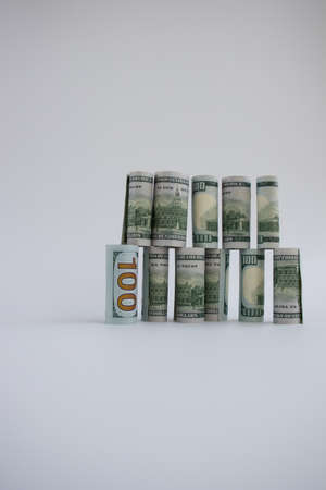 The construction from 100 dollars banknotes. Money construction.