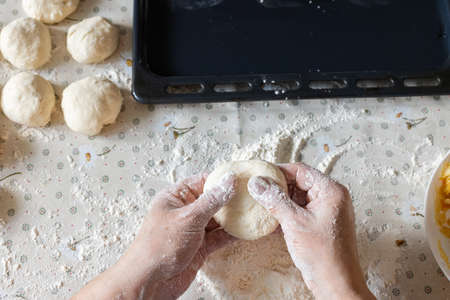 Woman cooking pies at home. Cooking and baking at home.の写真素材