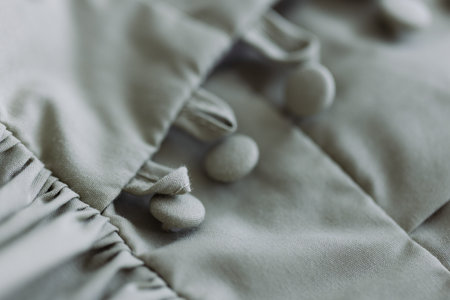 Buttons on the cotton dress closeup. Selective focus.の写真素材